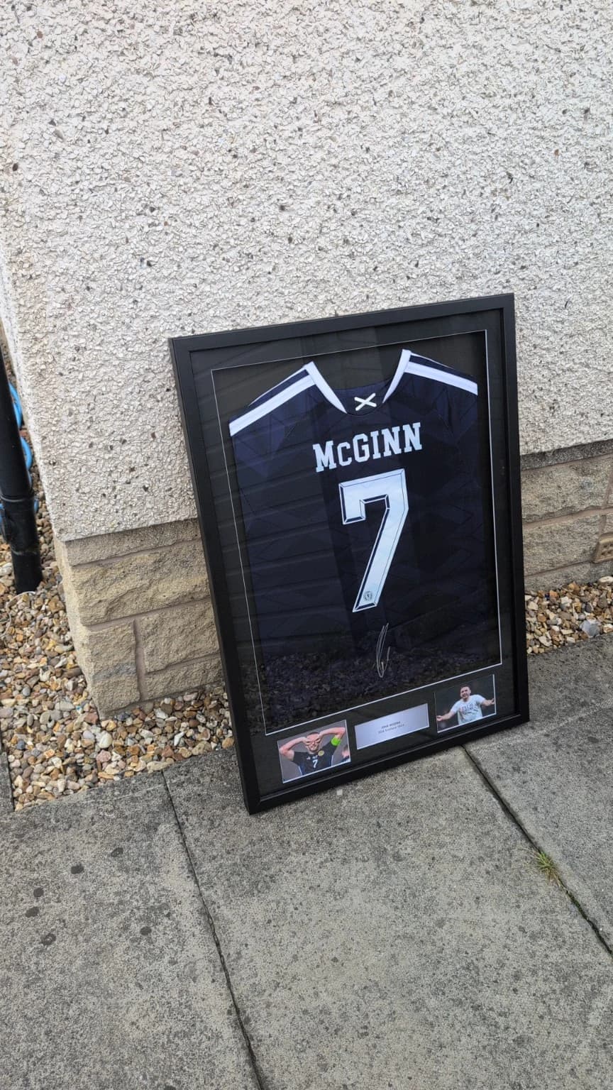 Close detail of bespoke football shirt framing